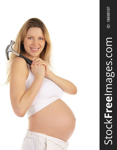 Happy pregnant woman with a hammer