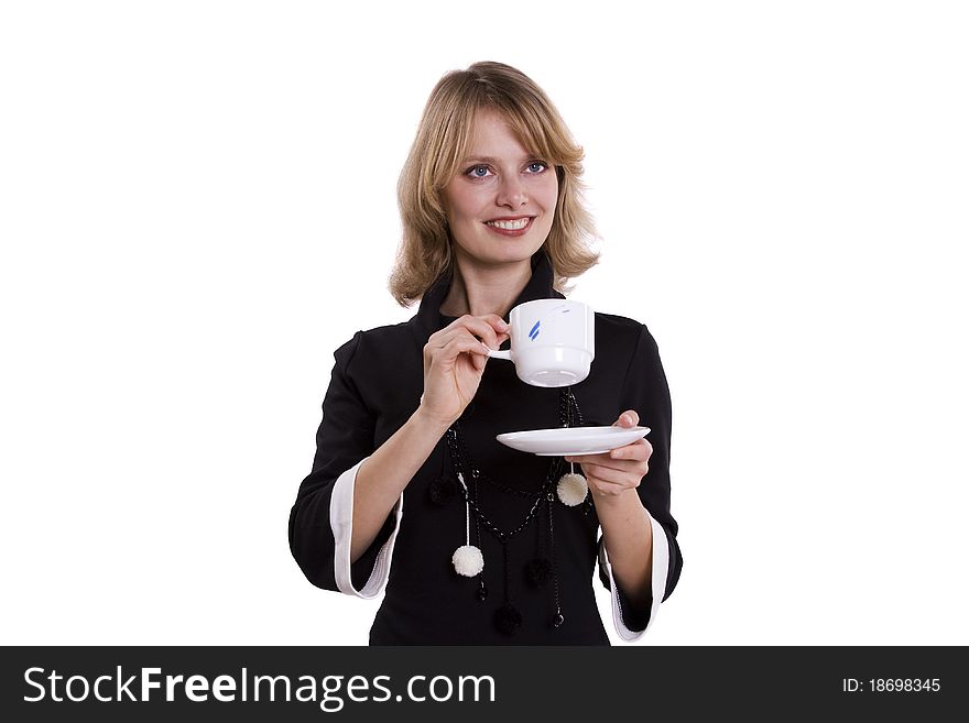 Close-up of a young businesswoman drinking coffee against white background. Business girl enjoying tea.