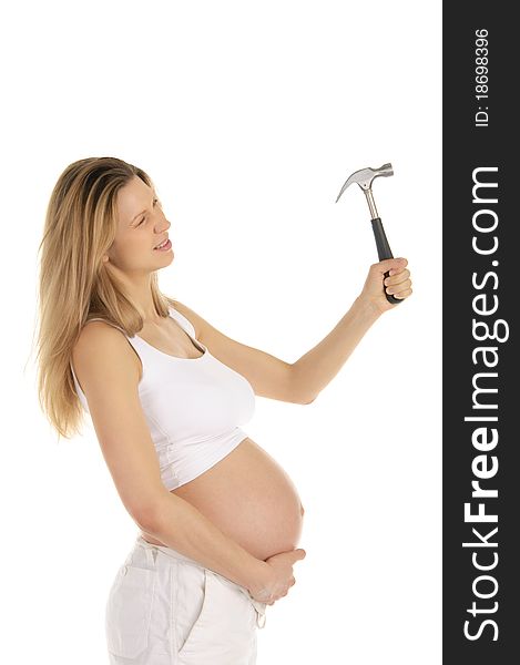 Pregnant woman works with a hammer