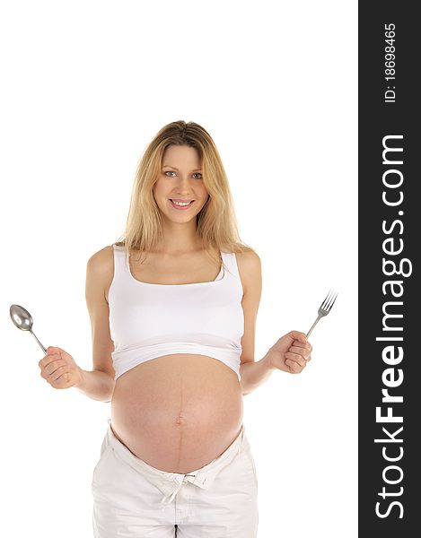 Pregnant woman with a spoon and fork isolated on white