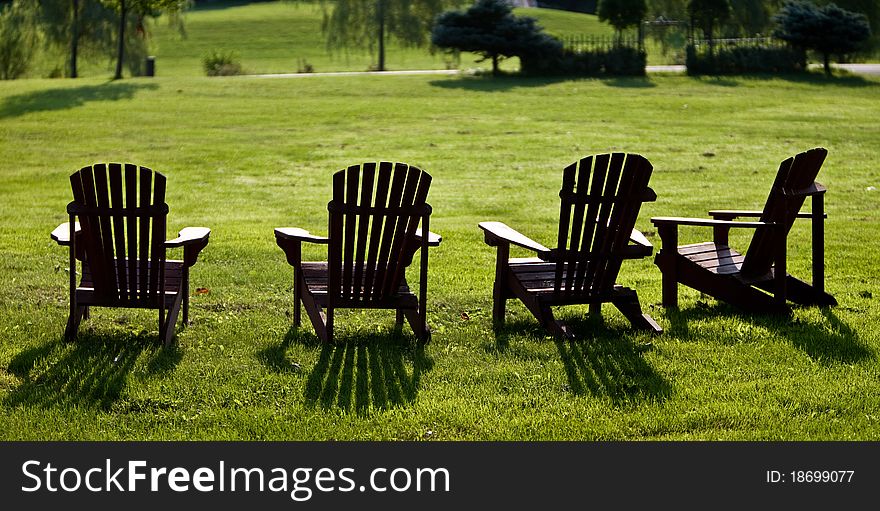 Lawn chairs in early morning sunlight. Lawn chairs in early morning sunlight