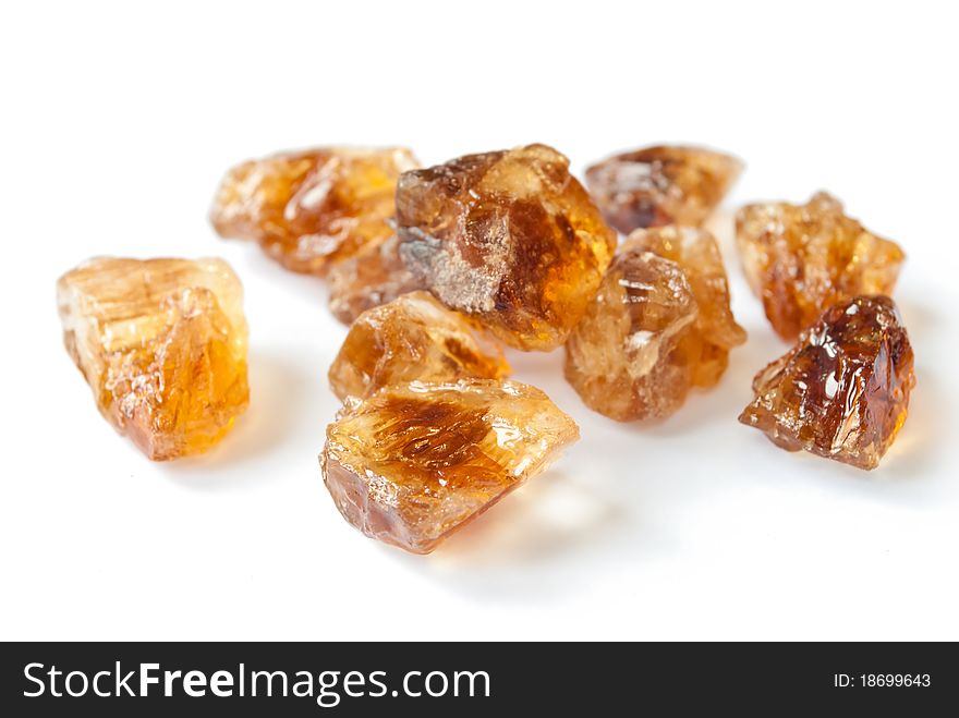 Brown caramelized sugar on white background. Brown caramelized sugar on white background