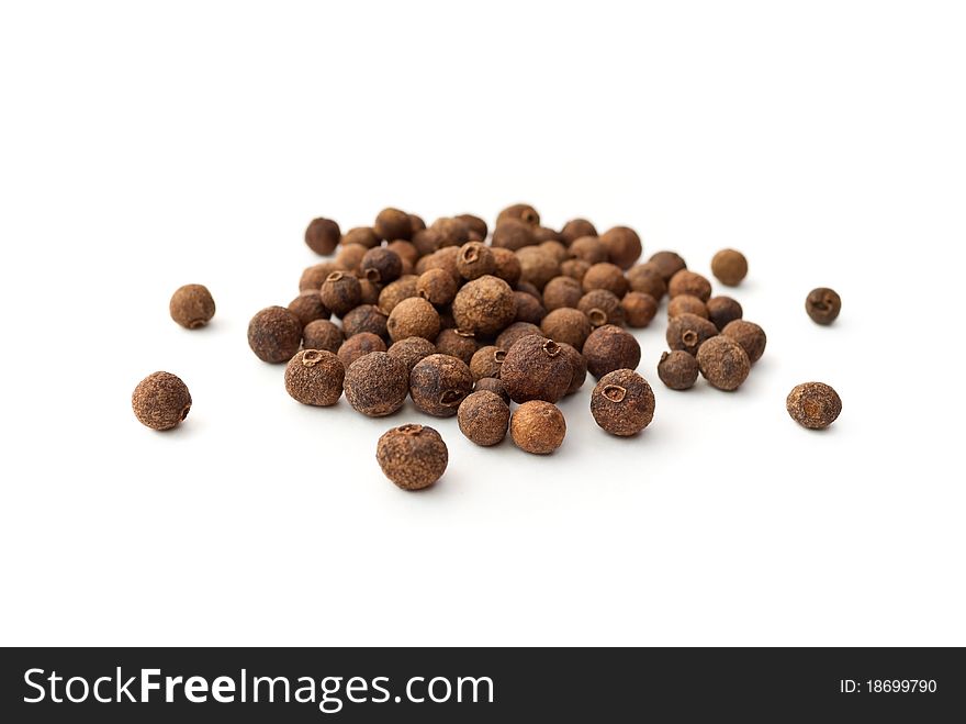A pile of peppercorns isolated on white