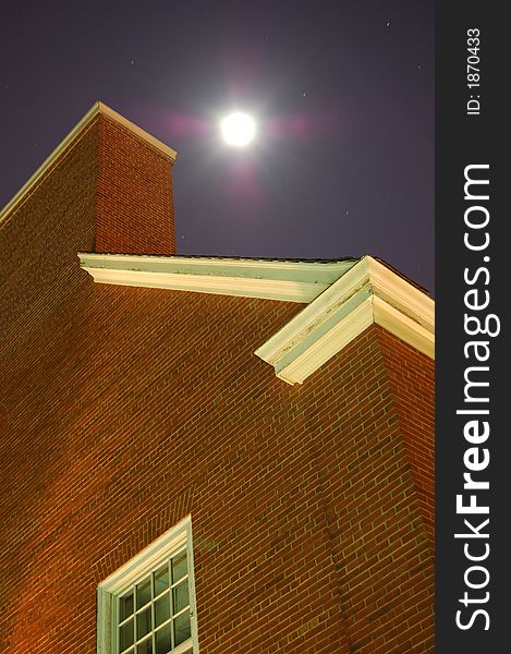 A night shot of a building in Rutgers University campus in a full moon. A night shot of a building in Rutgers University campus in a full moon.