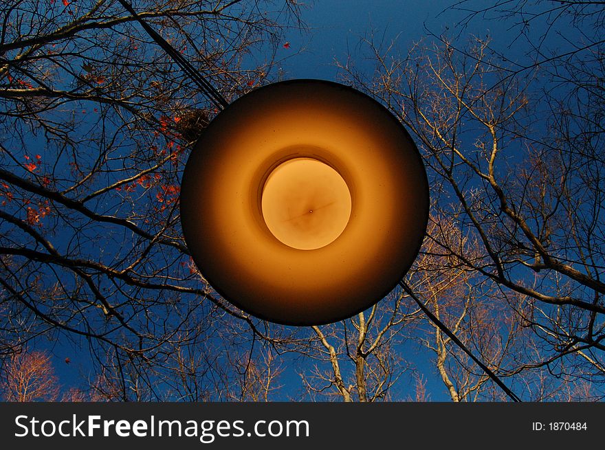 A shot of outdoor lamp during daytime, resembling a ufo. A shot of outdoor lamp during daytime, resembling a ufo.