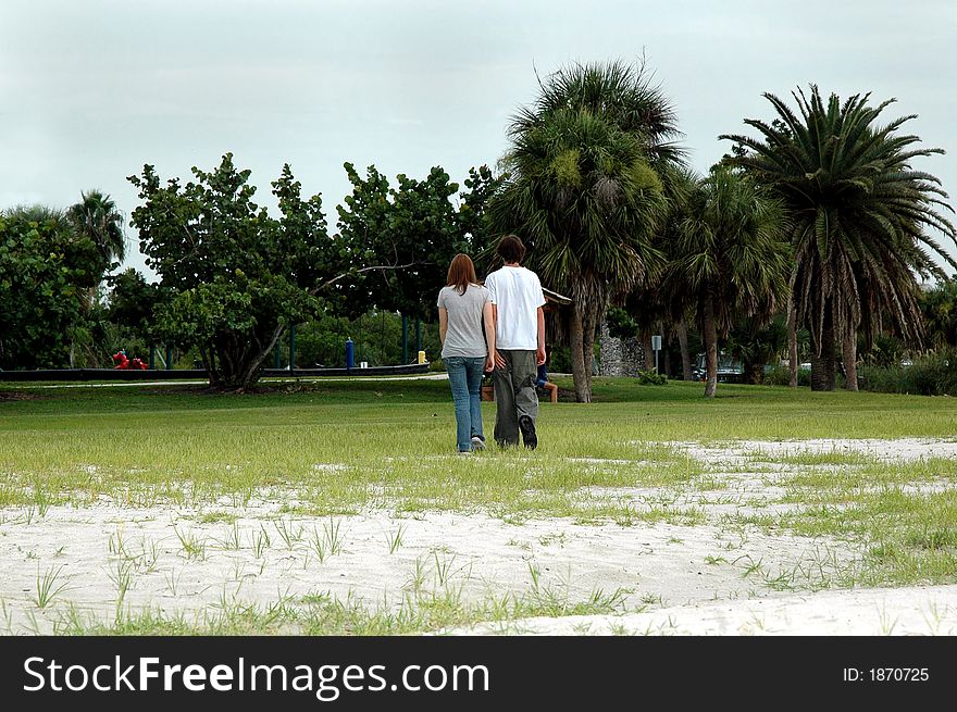 Teen Couple Walk In Park