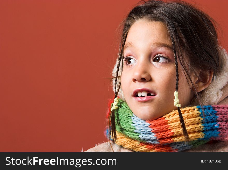 Child with coat and scarf