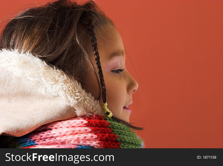 Child with coat and scarf