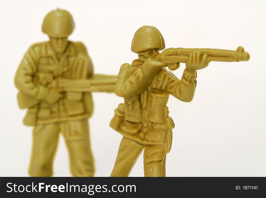 A couple of firing toy soldiers