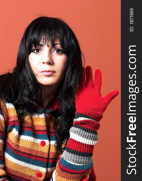 Beautiful woman in sweater dress with glove