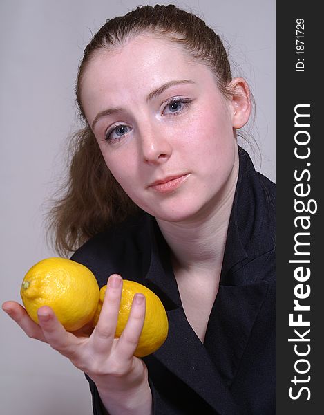 The girl with a lemon in the hand