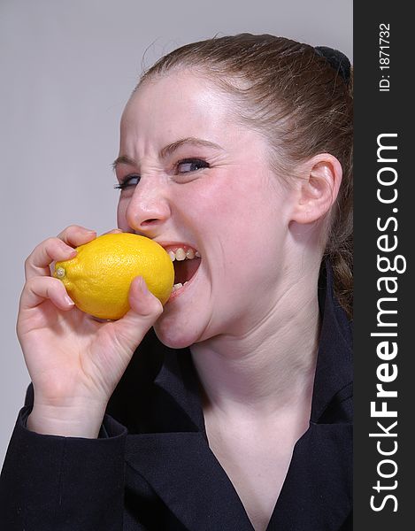 The girl with a  lemon in the hand
