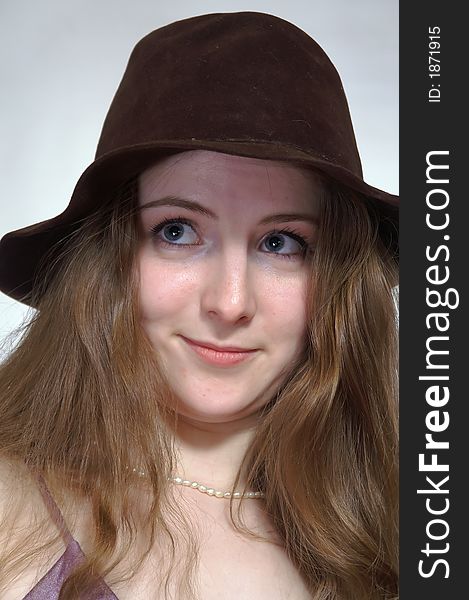 The girl with  long hair in a retro  hat