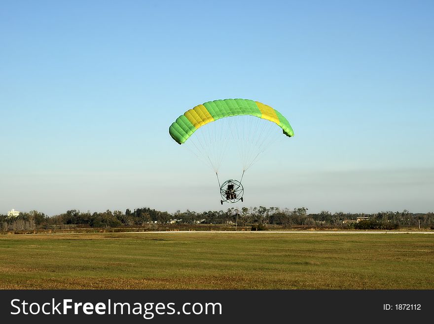 Paraglider taking off over Florida's flat land. Paraglider taking off over Florida's flat land.