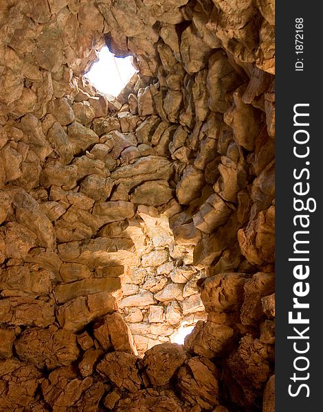 Light through a circular window, nuraghe - archeological building in sardinia (sardegna), Italy. Light through a circular window, nuraghe - archeological building in sardinia (sardegna), Italy