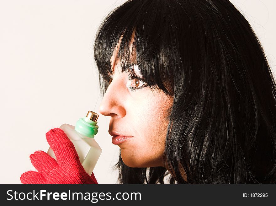 Woman with parfume on white background