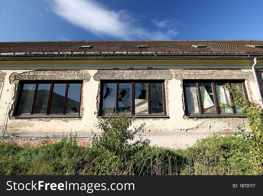 Old Facade With Broken Windows