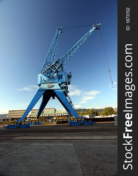 Harbor crane in blue sky