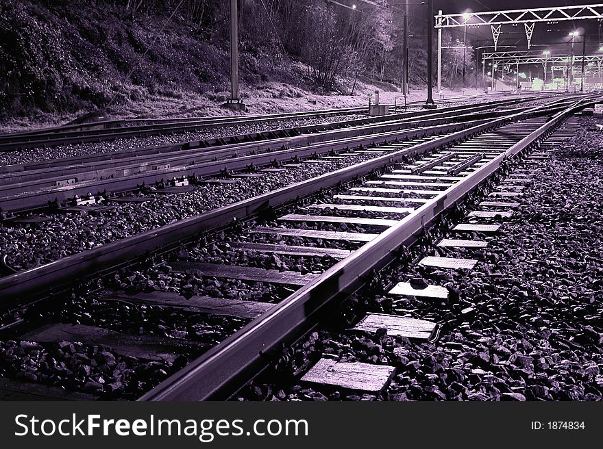Empty railroad tracks at nights