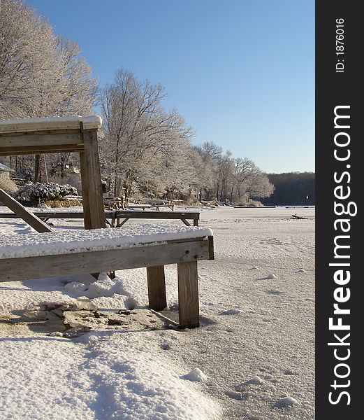 Docks trapped in the ice at a frozen lake