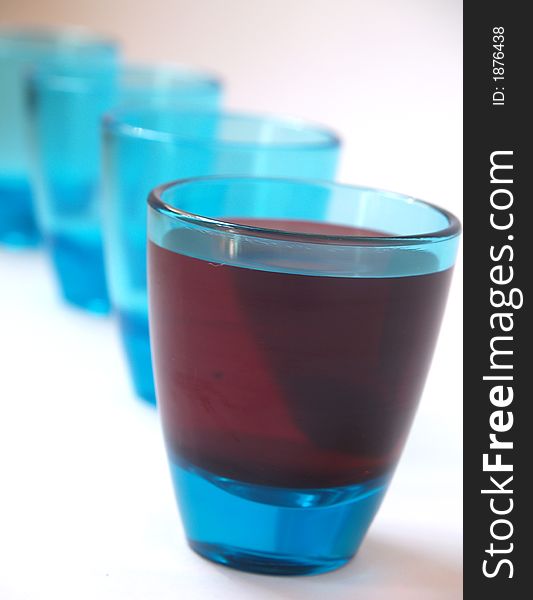 Blue tot galsses with drink