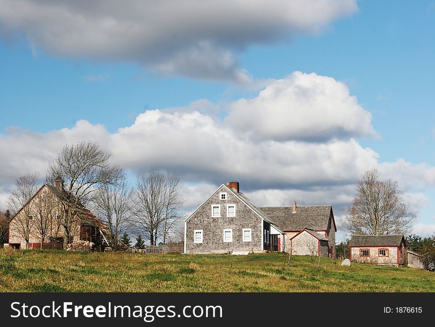 Farmland scenic with a house and other buildings. Farmland scenic with a house and other buildings