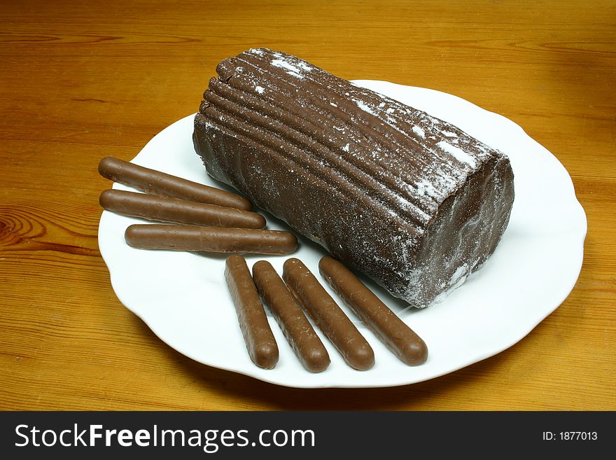 Chocolate yulelog and chocolate finger biscuits for a treat