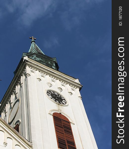 Sombor catholic church tower on the blue sky. Sombor catholic church tower on the blue sky