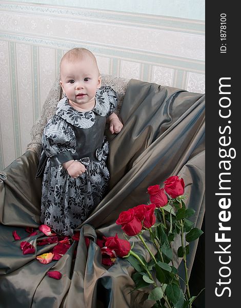 Victorian style portrait of cute little girl dressed in the formal wear. Victorian style portrait of cute little girl dressed in the formal wear.