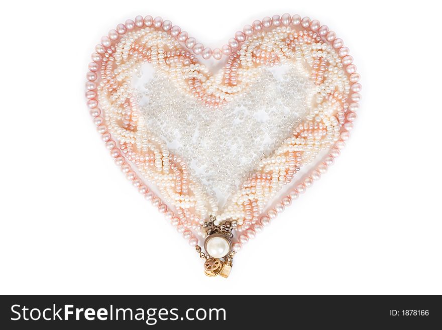 Heart-shaped pearl necklace on white background. Heart-shaped pearl necklace on white background