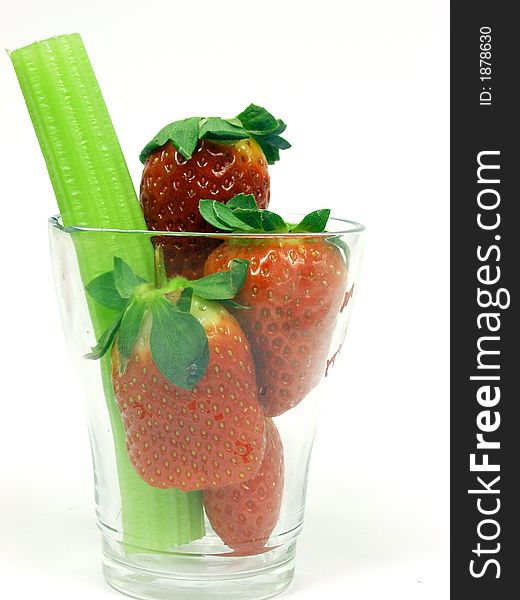 Fresh green cerely stem with red strawberry. Fresh green cerely stem with red strawberry