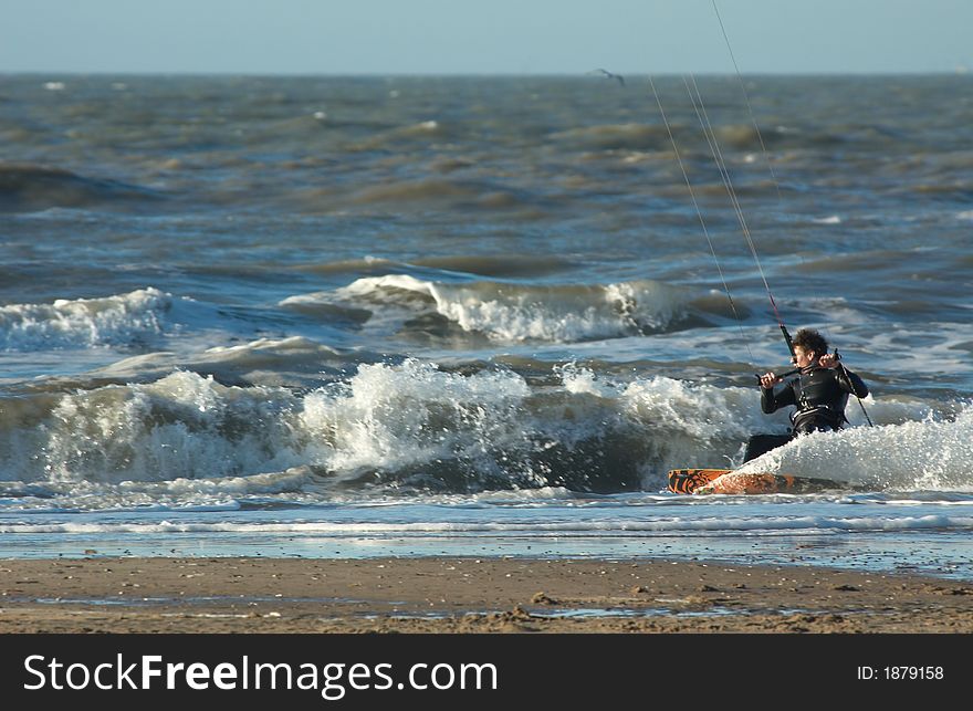 Kite surfer in action close to the beach