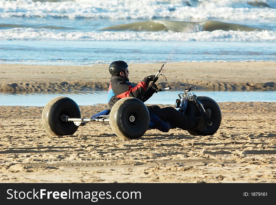 Driving a kite buggy on the beach