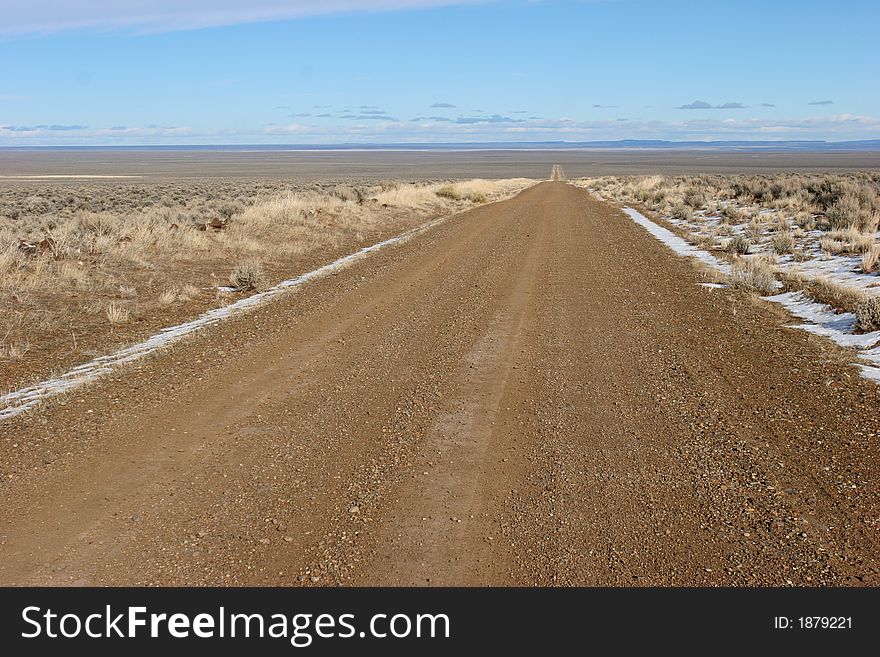 Gravel desert road; clean, crisp, sharp image.