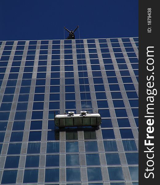 Window cleaners at their job. Window cleaners at their job.