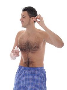 Handsome Young Man Cleaning Ears With Cotton Stick Stock Image