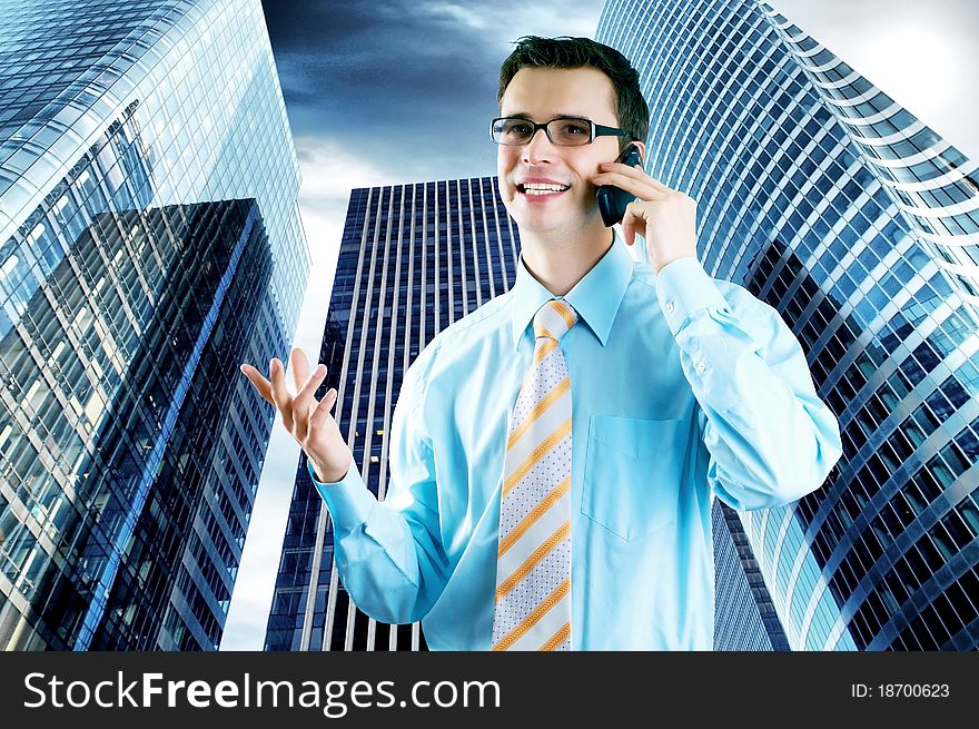 Hapiness Businessman standing on the business background. Hapiness Businessman standing on the business background