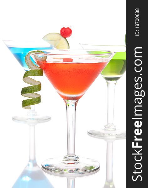 Martini Alcohol Cocktails three colors red, green and yellow over white background. Martini Alcohol Cocktails three colors red, green and yellow over white background