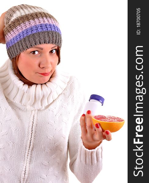 Sick Young woman with fruit and pills in her hand