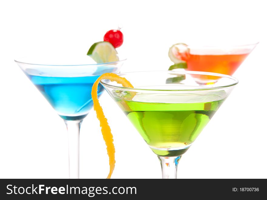 Martini Alcohol Cocktails three colors red, green and yellow over white background. Martini Alcohol Cocktails three colors red, green and yellow over white background