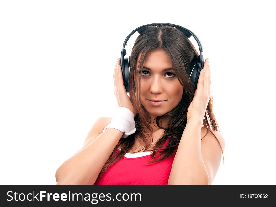 Teenage girl listen music in headphones isolated on a white background