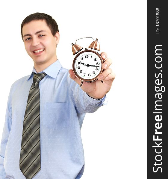 Businessman with an alarm clock in a hand. Isolated on white background