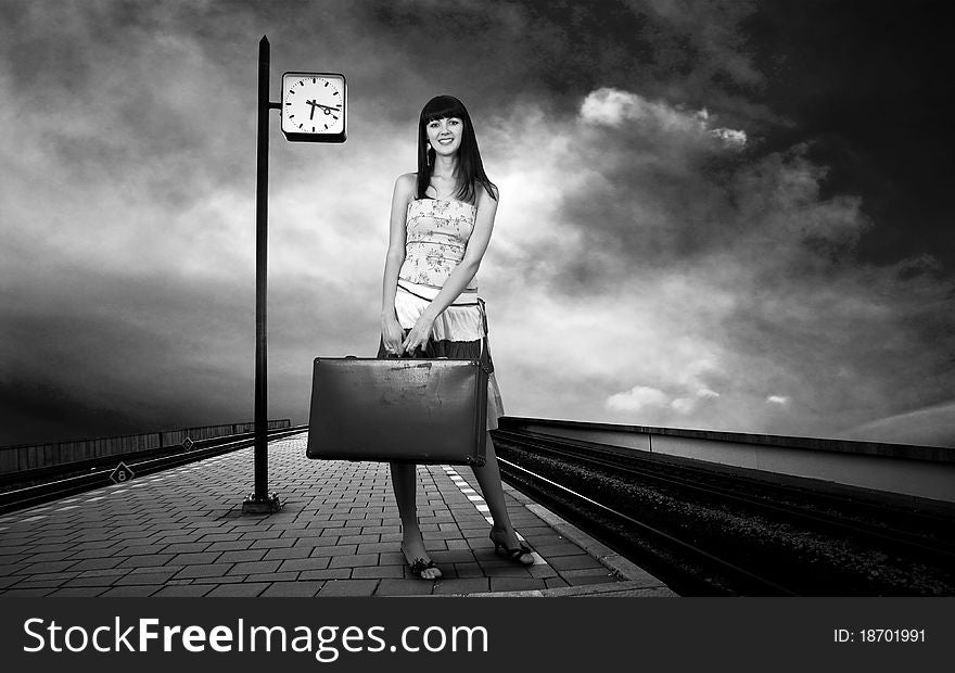 Woman waiting train on the platform of railway station. Woman waiting train on the platform of railway station