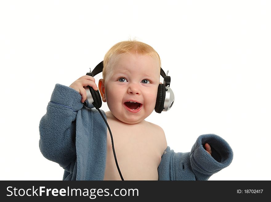 Happy baby with headphones isolated on white. Happy baby with headphones isolated on white