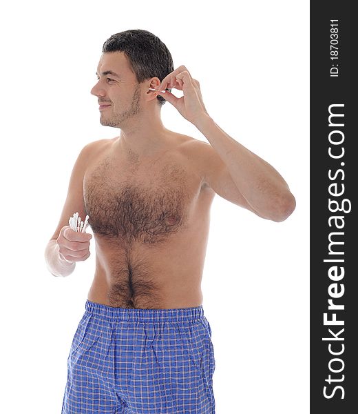 Handsome young man cleaning ears with cotton pad stick. isolated on white background. Handsome young man cleaning ears with cotton pad stick. isolated on white background