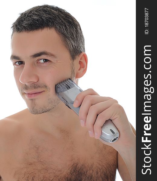 Young handsome male shaving face beard . isolated