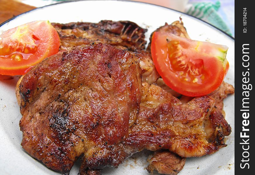 Grilled steak meat with tomatoe. Grilled steak meat with tomatoe