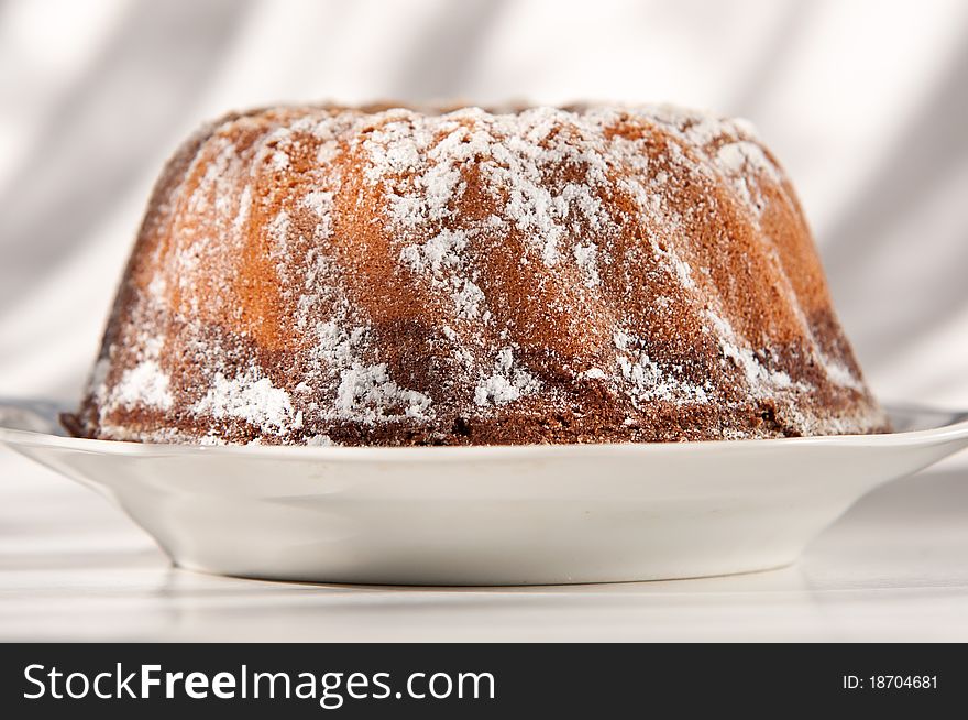 Cake with sugar on a plate