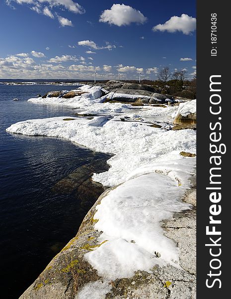 Beautiful spring shore vertical landscape with ice poles. Beautiful spring shore vertical landscape with ice poles