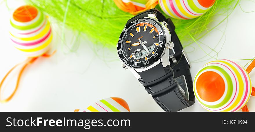Easter watch with nest and eggs on white